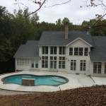 far shot of house with in-ground pool